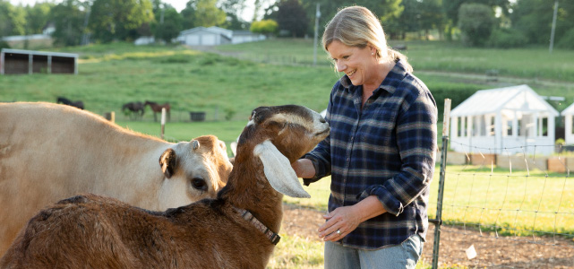 Jessica Hansen, chef and owner, of The Kitchen at Middleground Farms with two of her farm animals.
