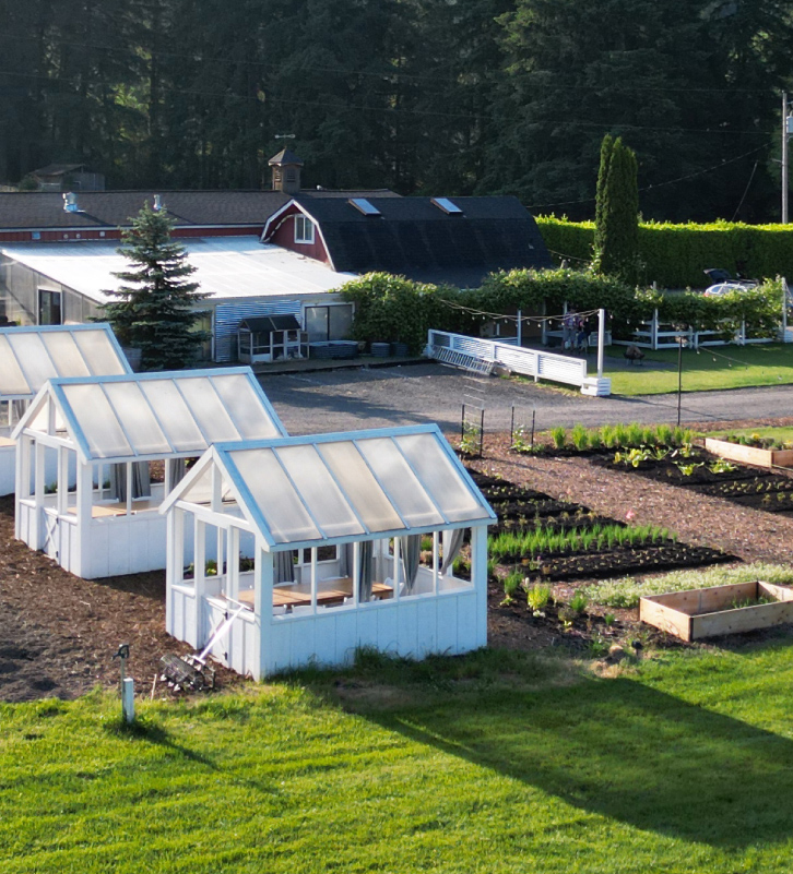 An aerial view of the dining greenhouses and culinary garden at The Kitchen at Middleground Farms