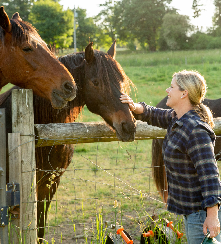 Farmer and Chef Jessica Hansen with her horses at Middleground Farms