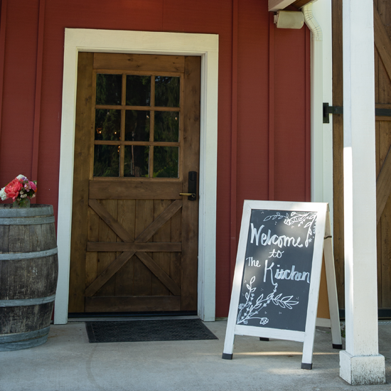 Welcome sign at the entry door to The Kitchen at Middleground Farms